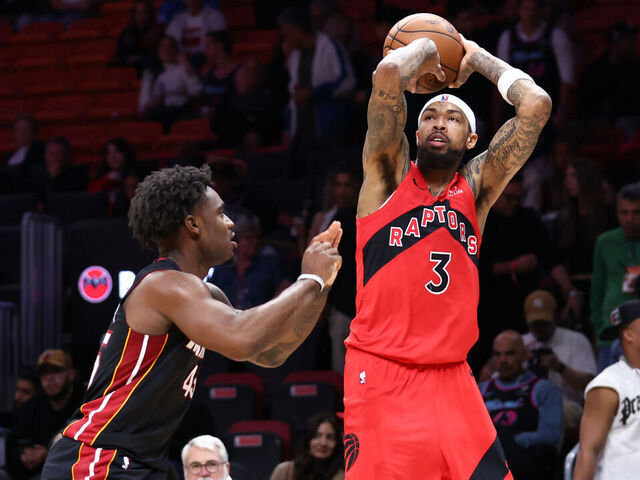MIAMI, FLORIDA - DECEMBER 15: Brandon Ingram #3 of the Toronto Raptors shoots the ball over Davion Mitchell #45 of the Miami Heat during the fourth quarter of the game at Kaseya Center on December 15, 2025 in Miami, Florida.