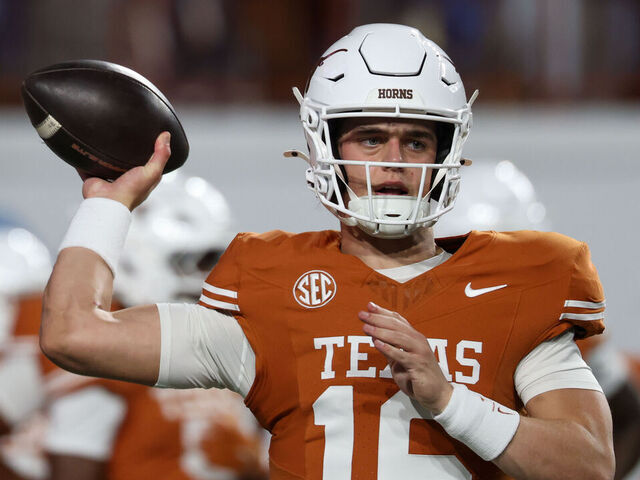 AUSTIN, TX - NOVEMBER 28: Quarterback Arch Manning #16 of the Texas Longhorns warms up before the SEC football game between Texas Longhorns and Texas A&M Aggies on November 28, 2025, at Darrell K Royal-Texas Memorial Stadium in Austin, TX.