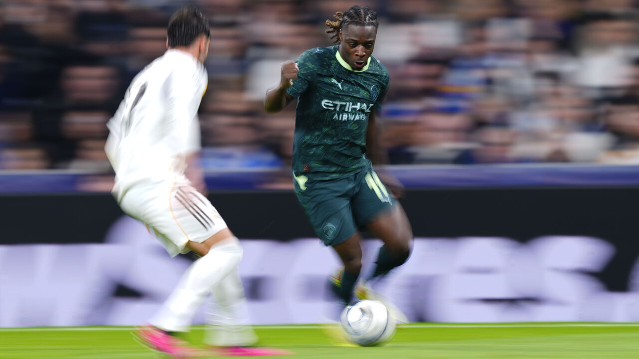 Jeremy Doku left winger of Manchester City and Belgium in action during the UEFA Champions League 2025/26 League Phase MD6 match between Real Madrid C.F. and Manchester City at Estadio Santiago Bernabeu on December 10, 2025 in Madrid, Spain.