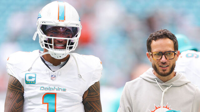 MIAMI GARDENS, FLORIDA - NOVEMBER 30: Tua Tagovailoa #1 and head coach Mike McDaniel of the Miami Dolphins speak on the field prior to a game against the New Orleans Saints at Hard Rock Stadium on November 30, 2025 in Miami Gardens, Florida.