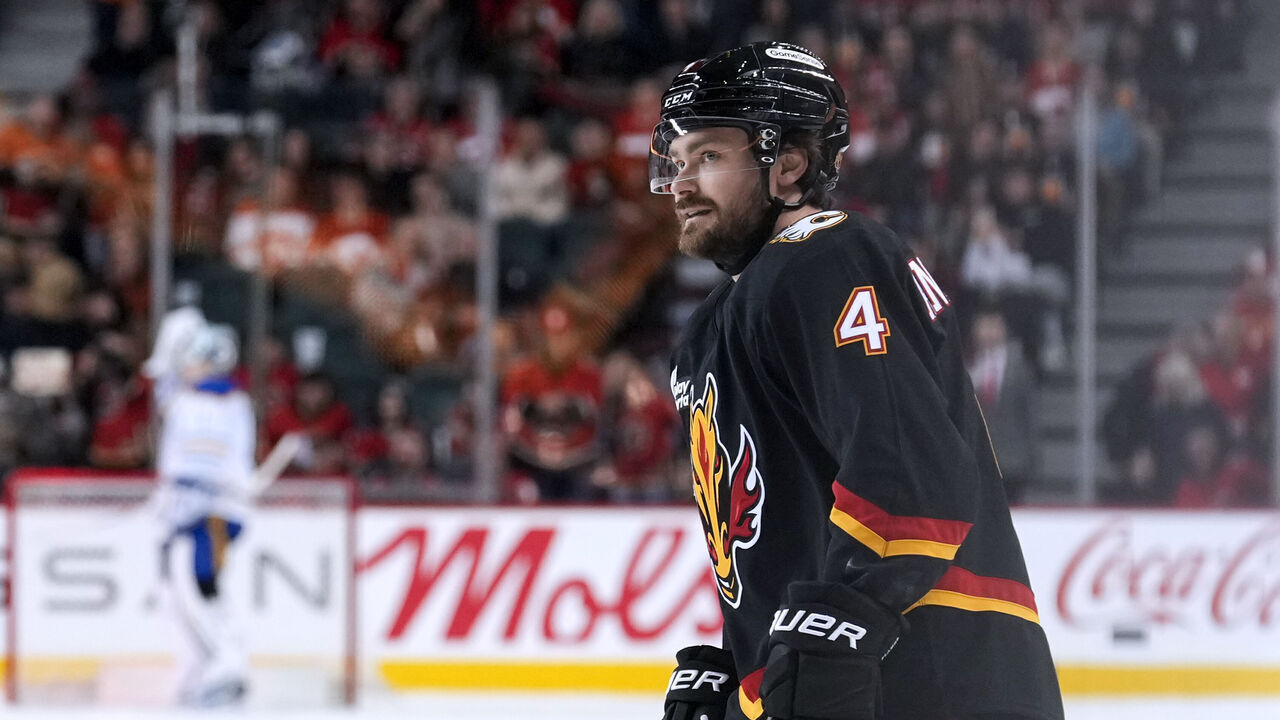 CALGARY, CANADA - DECEMBER 08: Rasmus Andersson #4 of the Calgary Flames skates from the bench after scoring on the Buffalo Sabres during the game at the Scotiabank Saddledome on December 08, 2025 in Calgary, Alberta.