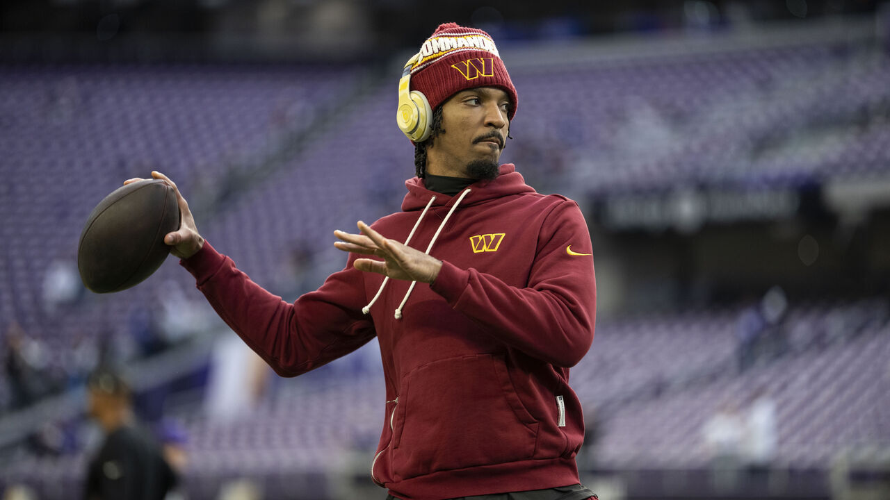 MINNEAPOLIS, MINNESOTA - DECEMBER 7: Jayden Daniels #5 of the Washington Commanders looks to pass during an NFL football game against the Minnesota Vikings at U.S. Bank Stadium on December 07, 2025 in Minneapolis, Minnesota.