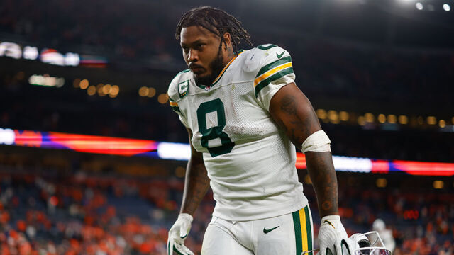 DENVER, CO - DECEMBER 14: Josh Jacobs #8 of the Green Bay Packers jogs off the field after the 26-34 loss to the Denver Broncos at Empower Field at Mile High on December 14, 2025 in Denver, Colorado.