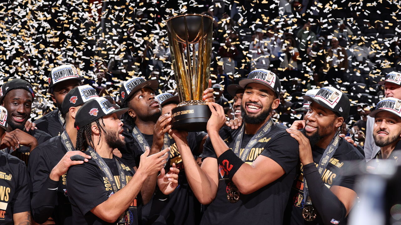 NEW YORK, NY - DECEMBER 16: The New York Knicks celebrate after winning the 2025 Emirates NBA Cup Championship Trophy during the NBA Emirates Cup Final on December 16, 2025 at T-Mobile Arena in Las Vegas, Nevada Mandatory Copyright Notice: Copyright 2025 NBAE