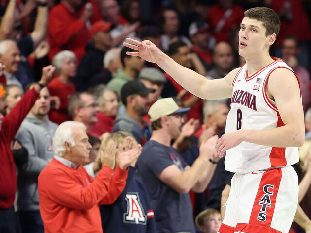 TUCSON, ARIZONA - DECEMBER 16: Ivan Kharchenkov #8 of the Arizona Wildcats reacts to a three-point shot against the Abilene Christian Wildcats during the first half of the NCAAB game at McKale Center on December 16, 2025 in Tucson, Arizona.