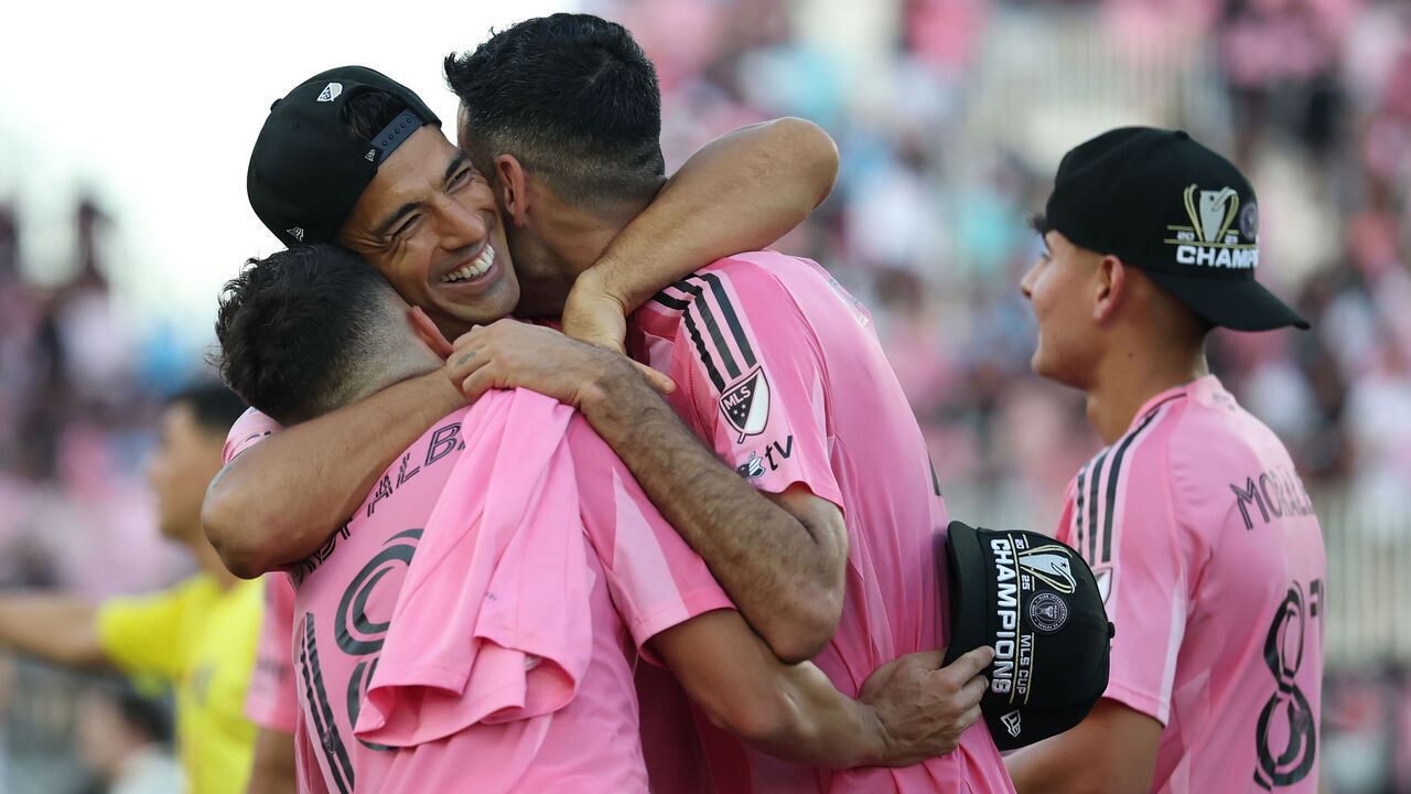 FORT LAUDERDALE, FLORIDA - DECEMBER 06: Jordi Alba #18, Luis Suárez #9 and Sergio Busquets #5 of Inter Miami CF celebrate the Championship win following the Audi 2025 MLS Cup Final match between Inter Miami CF and Vancouver Whitecaps FC at Chase Stadium on December 06, 2025 in Fort Lauderdale, Florida.