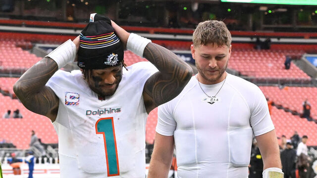 CLEVELAND, OHIO - OCTOBER 19: Tua Tagovailoa #1 and Quinn Ewers #14 of the Miami Dolphins walk off the field after the team's 31-6 loss to the Cleveland Browns at Huntington Bank Field on October 19, 2025 in Cleveland, Ohio.