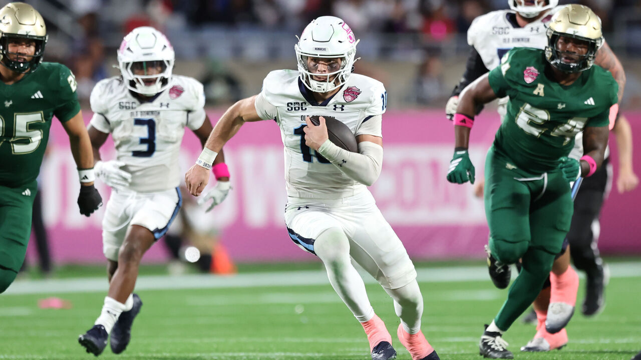 ORLANDO, FLORIDA - DECEMBER 17: Quinn Henicle #10 of the Old Dominion Monarchs runs the ball in the second quarter of the 2025 StaffDNA Cure Bowl between the USF Bulls and Old Dominion Monarchs at Camping World Stadium on December 17, 2025 in Orlando, Florida.