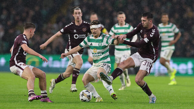 GLASGOW, SCOTLAND - DECEMBER 07: Daizen Maeda of Celtic vies with Oisin McEntee of Hearts during the Premier League match between Celtic and Heart of Midlothian at Celtic Park on December 07, 2025 in Glasgow, Scotland.