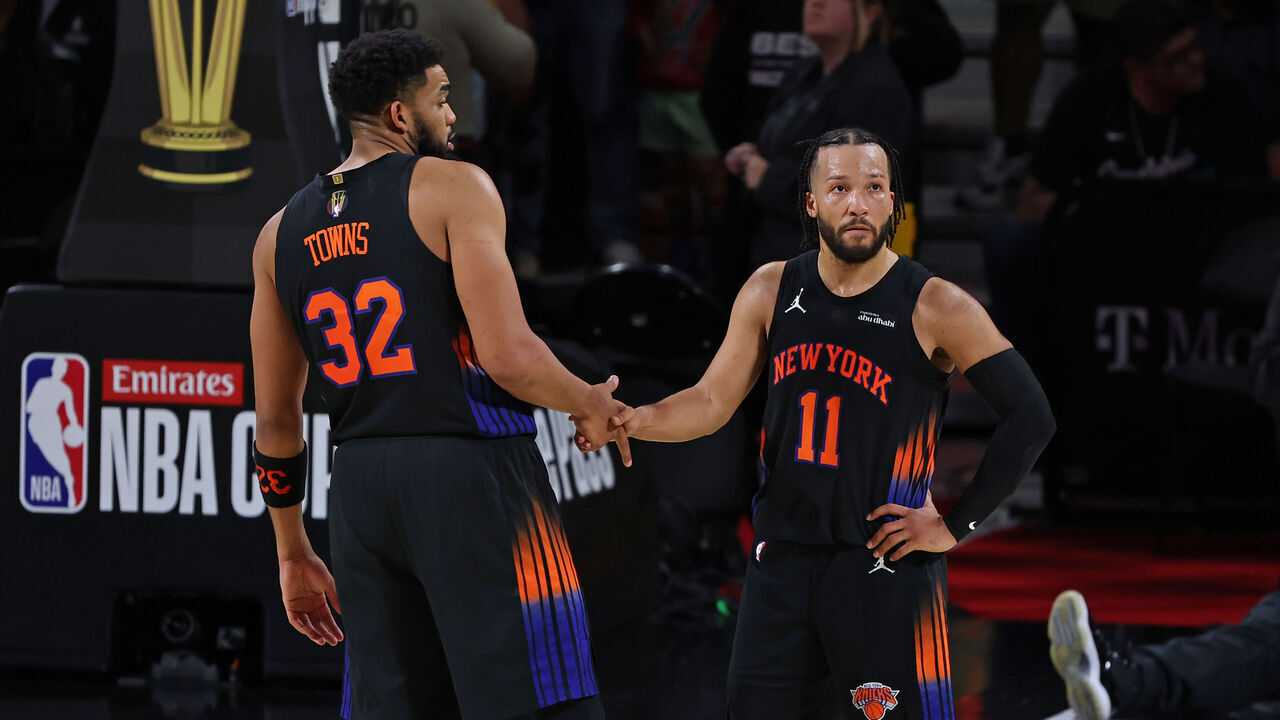 NEW YORK, NY - DECEMBER 16: Karl-Anthony Towns #32 and Jalen Brunson #11 of the New York Knicks high five during the game against the San Antonio Spurs during the NBA Emirates Cup Final on December 16, 2025 at T-Mobile Arena in Las Vegas, Nevada Mandatory Copyright Notice: Copyright 2025 NBAE