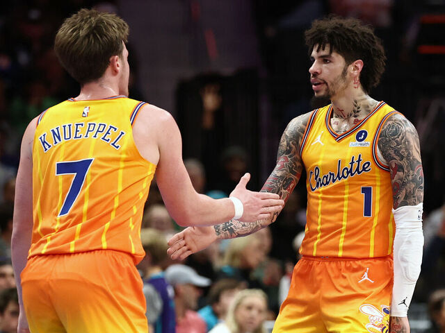 CHARLOTTE, NORTH CAROLINA - DECEMBER 18: Kon Knueppel #7 and Lamelo Ball #1 of the Charlotte Hornets react following a basket during the second quarter of the game against the Atlanta Hawks at Spectrum Center on December 18, 2025 in Charlotte, North Carolina.