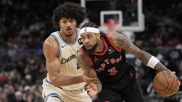 MILWAUKEE, WISCONSIN - DECEMBER 18: Brandon Ingram #3 of the Toronto Raptors dribbles the ball against Jericho Sims #00 of the Milwaukee Bucks during the second quarter at Fiserv Forum on December 18, 2025 in Milwaukee, Wisconsin.