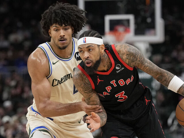 MILWAUKEE, WISCONSIN - DECEMBER 18: Brandon Ingram #3 of the Toronto Raptors dribbles the ball against Jericho Sims #00 of the Milwaukee Bucks during the second quarter at Fiserv Forum on December 18, 2025 in Milwaukee, Wisconsin.