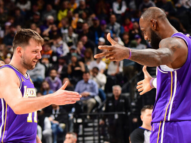 SALT LAKE CITY, UT - DECEMBER 18: Luka Doncic #77 and LeBron James #23 of the Los Angeles Lakers celebrates during the game against the Utah Jazz on December 18, 2025 at Delta Center in Salt Lake City, Utah. Mandatory Copyright Notice: Copyright 2025 NBAE