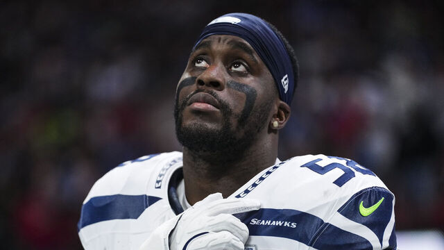 ATLANTA, GEORGIA - DECEMBER 07: Derick Hall #58 of the Seattle Seahawks looks on from the sideline during the national anthem prior to an NFL football game against the Atlanta Falcons at Mercedes-Benz Stadium on December 7, 2025 in Atlanta, Georgia.