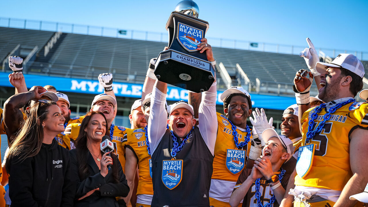 CONWAY, SOUTH CAROLINA - DECEMBER 19: Head Coach Lance Taylor of the Western Michigan Broncos celebrates with the team after the 2025 Myrtle Beach Bowl against the Kennesaw State Owls at Brooks Stadium on December 19, 2025 in Conway, South Carolina.
