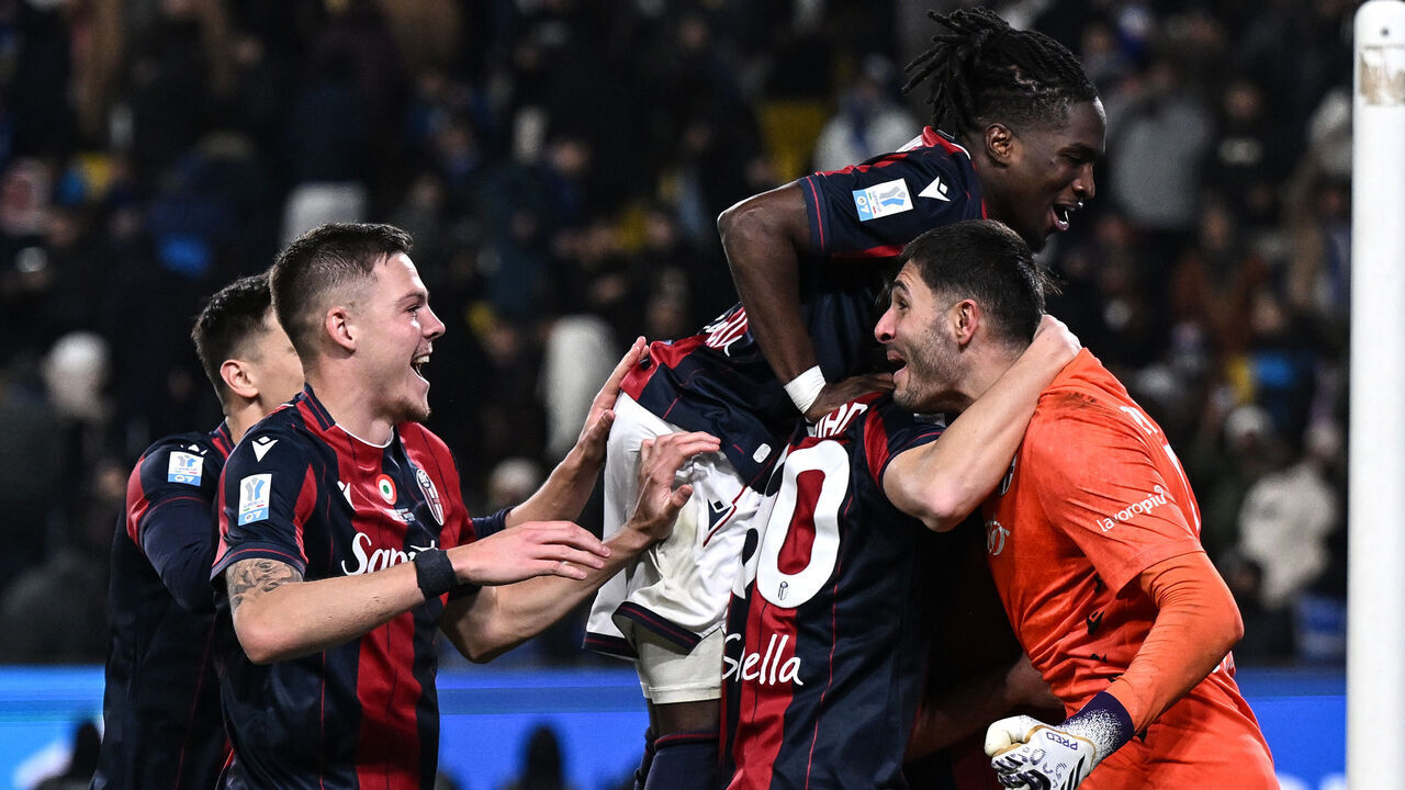 RIYADH, SAUDI ARABIA - DECEMBER 19: Federico Ravaglia of Bologna, Jonathan Rowe of Bologna and Emil Holm of Bologna celebrates during the Supercoppa Italiana semifinal match between Bologna FC 1909 and FC Internazionale at King Saud University Stadium on December 19, 2025 in Riyadh, Saudi Arabia.