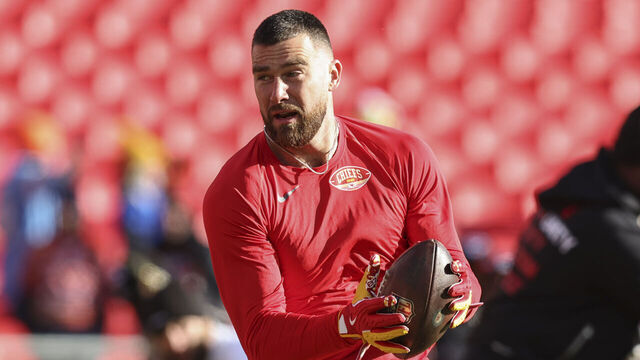 KANSAS CITY, MO - DECEMBER 14: Kansas City Chiefs tight end Travis Kelce (87) catches a pass before an NFL game between the Los Angeles Chargers and Kansas City Chiefs on December 14, 2025 at GEHA Field at Arrowhead Stadium in Kansas City, MO.