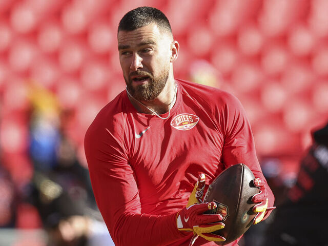 KANSAS CITY, MO - DECEMBER 14: Kansas City Chiefs tight end Travis Kelce (87) catches a pass before an NFL game between the Los Angeles Chargers and Kansas City Chiefs on December 14, 2025 at GEHA Field at Arrowhead Stadium in Kansas City, MO.