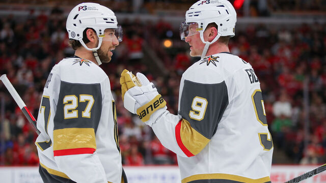 CHICAGO, IL - APRIL 27: Vegas Golden Knights defenseman Shea Theodore (27) and Vegas Golden Knights center Jack Eichel (9) chat during the overtime period during a game between the Vegas Golden Knights and the Chicago Blackhawks on April 27, 2022 at the United Center in Chicago, IL.