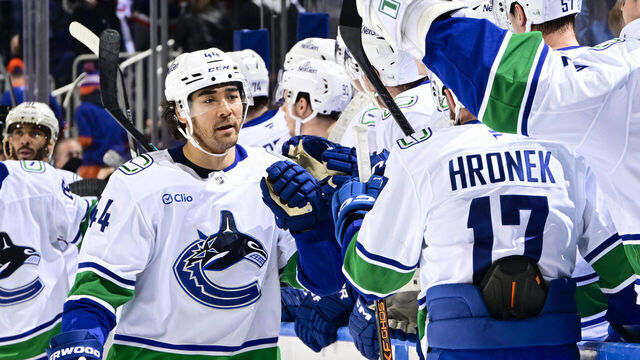 ELMONT, NEW YORK - DECEMBER 19: Kiefer Sherwood #44 of the Vancouver Canucks celebrates his third goal of the game at 18:39 for a hat-trick against the New York Islanders at UBS Arena on December 19, 2025 in Elmont, New York.