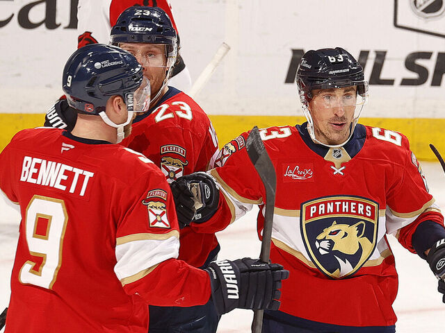 SUNRISE, FLORIDA - DECEMBER 19: Brad Marchand #63 of the Florida Panthers celebrates his goal with teammates during the third period against the Carolina Hurricanes at the Amerant Bank Arena on December 19, 2025 in Sunrise, Florida.