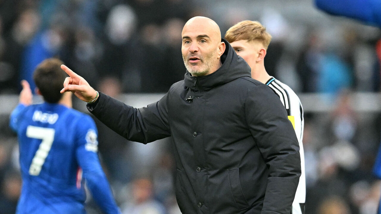 Chelsea's Italian head coach Enzo Maresca reacts on the pitch after the English Premier League football match between Newcastle United and Chelsea at St James' Park in Newcastle-upon-Tyne, north east England on December 20, 2025. The game finished 2-2. / RESTRICTED TO EDITORIAL USE. No use with unauthorized audio, video, data, fixture lists, club/league logos or 'live' services. Online in-match use limited to 120 images. An additional 40 images may be used in extra time. No video emulation. Social media in-match use limited to 120 images. An additional 40 images may be used in extra time. No use in betting publications, games or single club/league/player publications. /