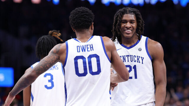 ATLANTA, GEORGIA - DECEMBER 20: Jayden Quaintance #21 reacts with Otega Oweh #00 of the Kentucky Wildcats against the St. John's Red Storm during the second half of the game between the St. John's Red Storm and Kentucky Wildcats at State Farm Arena on December 20, 2025 in Atlanta, Georgia.