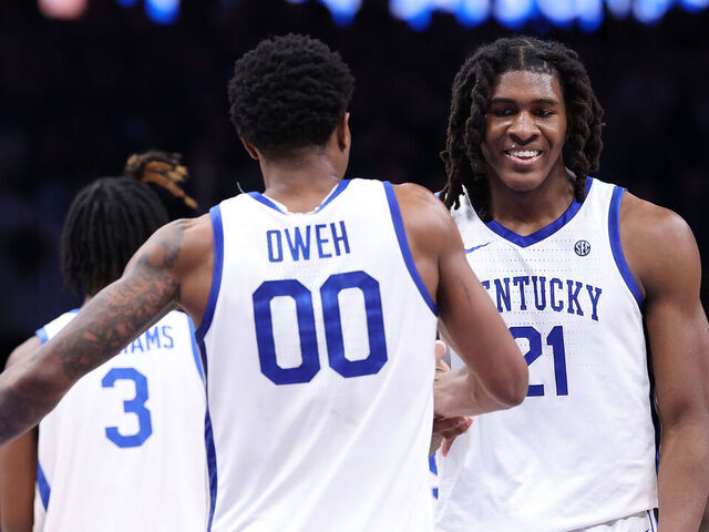 ATLANTA, GEORGIA - DECEMBER 20: Jayden Quaintance #21 reacts with Otega Oweh #00 of the Kentucky Wildcats against the St. John's Red Storm during the second half of the game between the St. John's Red Storm and Kentucky Wildcats at State Farm Arena on December 20, 2025 in Atlanta, Georgia.