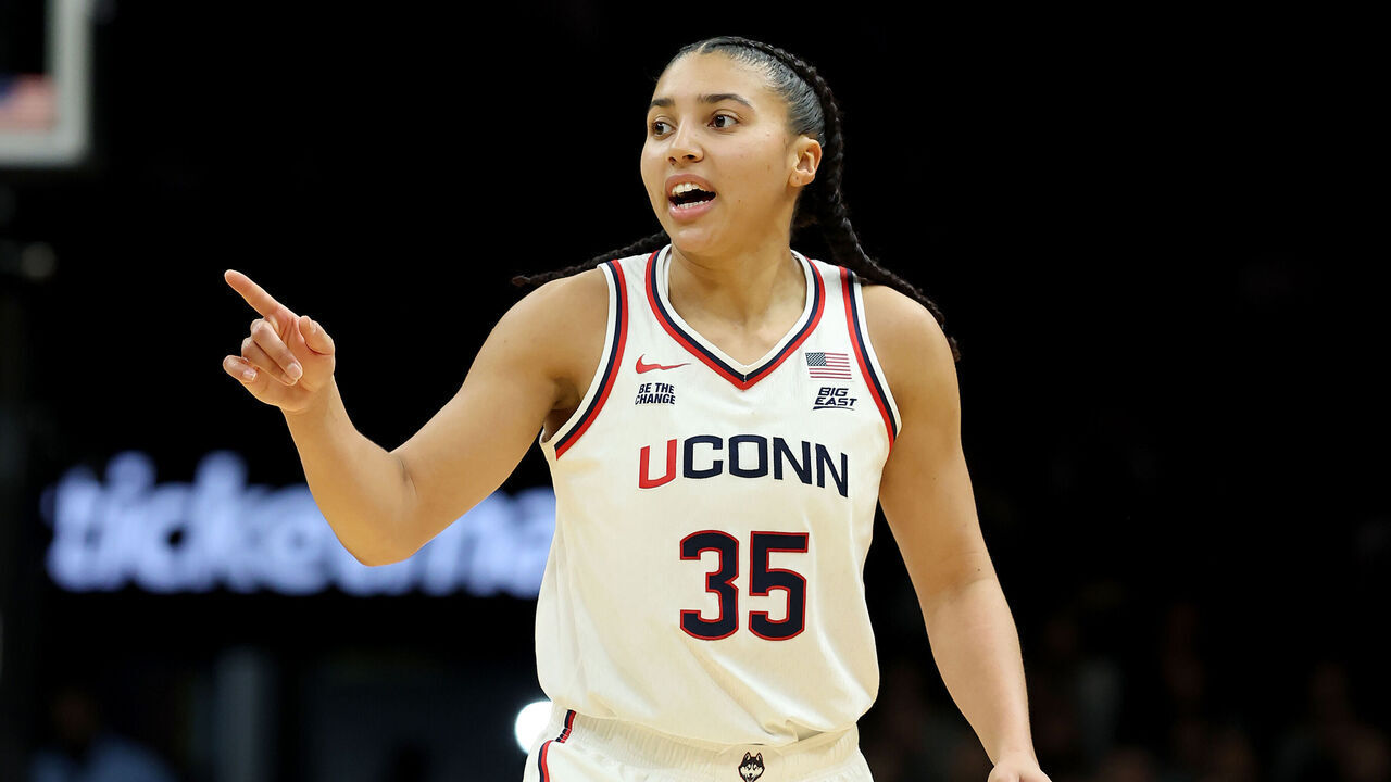 NEW YORK, NEW YORK - DECEMBER 20: Azzi Fudd #35 of the UConn Huskies celebrates her three point shot in the second half against the Iowa Hawkeyes during the 2025 Women's Champions Classic at Barclays Center on December 20, 2025 in the Brooklyn borough of New York City.