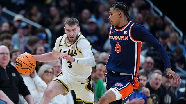 INDIANAPOLIS, IN - DECEMBER 20: Purdue Boilermakers guard Braden Smith (3) brings the ball up court against Auburn Tigers guard Elyjah Freeman (6) during the Indy Classic on December 20, 2025, at Gainbridge Fieldhouse in Indianapolis, Indiana.