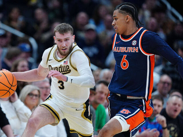 INDIANAPOLIS, IN - DECEMBER 20: Purdue Boilermakers guard Braden Smith (3) brings the ball up court against Auburn Tigers guard Elyjah Freeman (6) during the Indy Classic on December 20, 2025, at Gainbridge Fieldhouse in Indianapolis, Indiana.