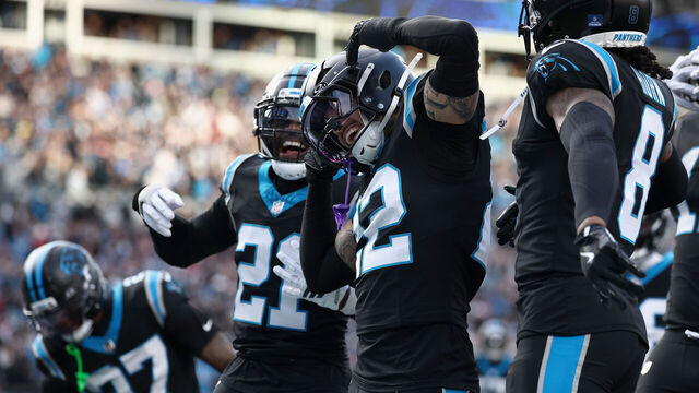 CHARLOTTE, NORTH CAROLINA - DECEMBER 21: Lathan Ransom #22 of the Carolina Panthers celebrates with teammates after a game winning interception against the Tampa Bay Buccaneers in the fourth quarter of a game at Bank of America Stadium on December 21, 2025 in Charlotte, North Carolina.