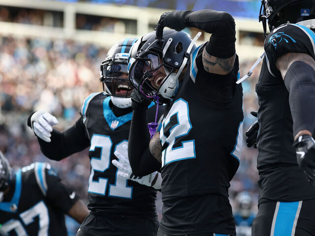 CHARLOTTE, NORTH CAROLINA - DECEMBER 21: Lathan Ransom #22 of the Carolina Panthers celebrates with teammates after a game winning interception against the Tampa Bay Buccaneers in the fourth quarter of a game at Bank of America Stadium on December 21, 2025 in Charlotte, North Carolina.