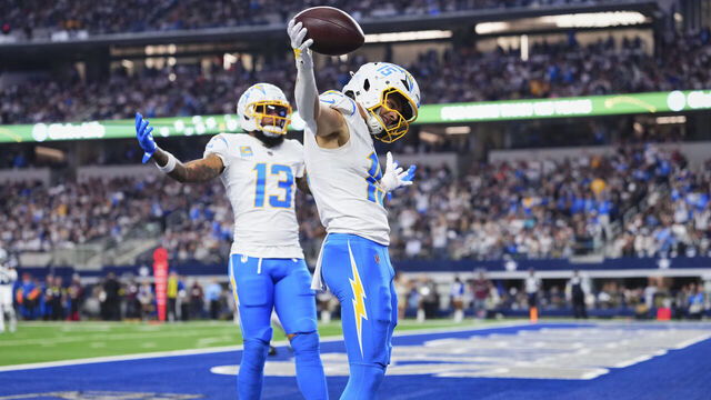 ARLINGTON, TX - DECEMBER 21: Ladd McConkey #15 of the Los Angeles Chargers celebrates after scoring a touchdown against the Dallas Cowboys during the first half of an NFL football game at AT&T Stadium on December 21, 2025 in Arlington, Texas.