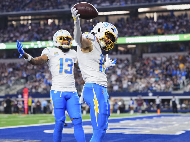 ARLINGTON, TX - DECEMBER 21: Ladd McConkey #15 of the Los Angeles Chargers celebrates after scoring a touchdown against the Dallas Cowboys during the first half of an NFL football game at AT&T Stadium on December 21, 2025 in Arlington, Texas.