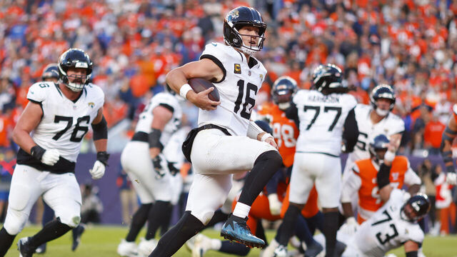 DENVER, COLORADO - DECEMBER 21: Trevor Lawrence #16 of the Jacksonville Jaguars runs for a third quarter touchdown against the Denver Broncos at Empower Field At Mile High on December 21, 2025 in Denver, Colorado.