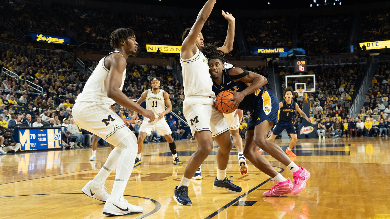 ANN ARBOR, MICHIGAN - DECEMBER 21: Trey McKenney #1 of the Michigan Wolverines defends against Justin Archer #0 of the La Salle Explorers during the second half at Crisler Arena on December 21, 2025 in Ann Arbor, Michigan.
