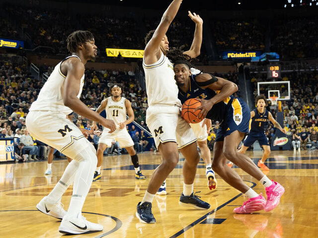 ANN ARBOR, MICHIGAN - DECEMBER 21: Trey McKenney #1 of the Michigan Wolverines defends against Justin Archer #0 of the La Salle Explorers during the second half at Crisler Arena on December 21, 2025 in Ann Arbor, Michigan.