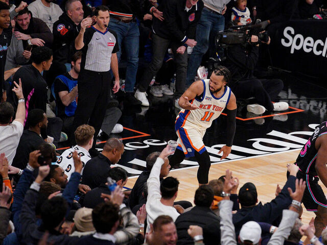 NEW YORK, NEW YORK - DECEMBER 21: Jalen Brunson #11 of the New York Knicks reacts after his made three-point basket against the Miami Heat in the second half at Madison Square Garden on December 21, 2025 in New York City.