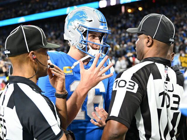 DETROIT, MI - DECEMBER 21: Detroit Lions quarterback Jared Goff (16) talks with side judge Eugene Hall (103) about the final play where offensive pass interference wiped out a potential game winning touchdown during the Detroit Lions versus the Pittsburgh Steelers game on Sunday December 21, 2025 at Ford Field in Detroit, MI.