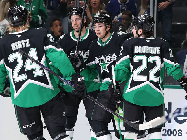 DALLAS, TEXAS - DECEMBER 21: Jason Robertson #21 of the Dallas Stars celebrates with Roope Hintz #24, Alexander Petrovic #28, and Mavrik Bourque #22 after scoring a goal during the first period against the Toronto Maple Leafs at American Airlines Center on December 21, 2025 in Dallas, Texas.