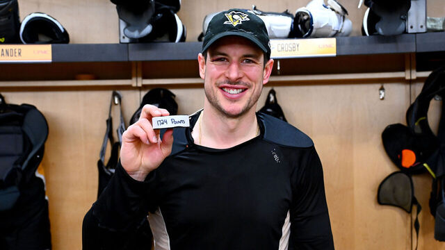 PITTSBURGH, PA - DECEMBER 21: Sidney Crosby #87 of the Pittsburgh Penguins posed with his 1,724 point puck after the game against the Montréal Canadiens at PPG PAINTS Arena on December 21h, 2025 in Pittsburgh, Pennsylvania.