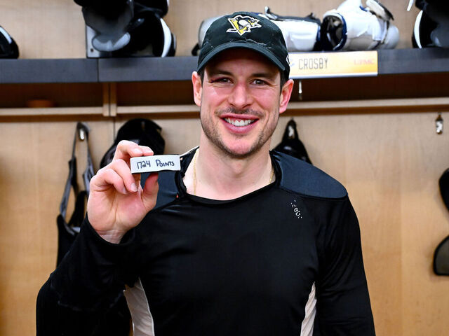 PITTSBURGH, PA - DECEMBER 21: Sidney Crosby #87 of the Pittsburgh Penguins posed with his 1,724 point puck after the game against the Montréal Canadiens at PPG PAINTS Arena on December 21h, 2025 in Pittsburgh, Pennsylvania.