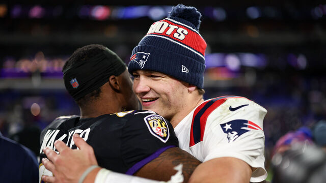BALTIMORE, MARYLAND - DECEMBER 21: Devontez Walker #81 of the Baltimore Ravens and Drake Maye #10 of the New England Patriots hug after the game at M&T Bank Stadium on December 21, 2025 in Baltimore, Maryland.