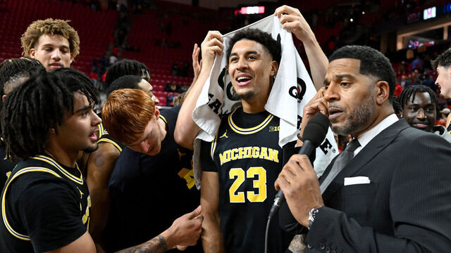COLLEGE PARK, MARYLAND - DECEMBER 13: Yaxel Lendeborg #23 of the Michigan Wolverines is interviewed by Jim Jackson after a victory against the Maryland Terrapins at Xfinity Center on December 13, 2025 in College Park, Maryland.
