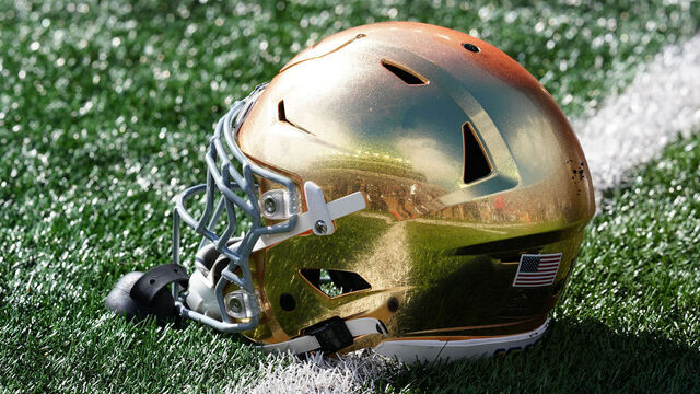 SOUTH BEND, IN - OCTOBER 11: Notre Dame Fighting Irish helmet sits on the field before a game against the North Carolina State Wolfpack on October 11, 2025, at Notre Dame Stadium in South Bend, Indiana.
