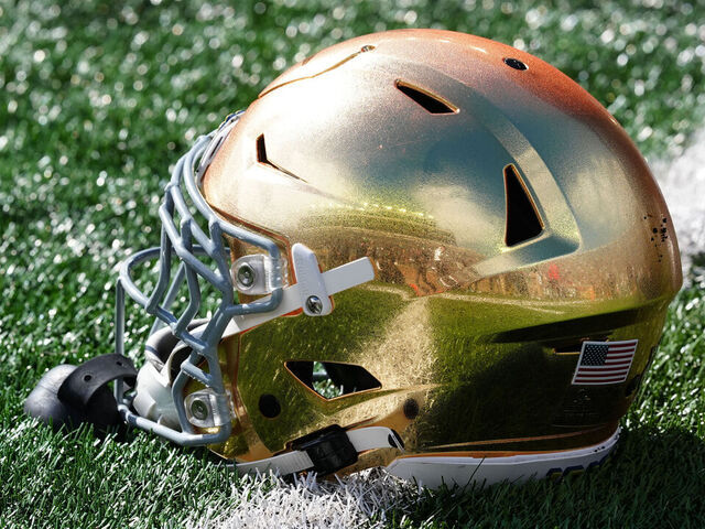 SOUTH BEND, IN - OCTOBER 11: Notre Dame Fighting Irish helmet sits on the field before a game against the North Carolina State Wolfpack on October 11, 2025, at Notre Dame Stadium in South Bend, Indiana.