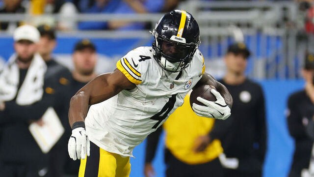 DETROIT, MICHIGAN - DECEMBER 21: DK Metcalf #4 of the Pittsburgh Steelers catches a pass in front of Avonte Maddox #29 of the Detroit Lions during the fourth quarter at Ford Field on December 21, 2025 in Detroit, Michigan.