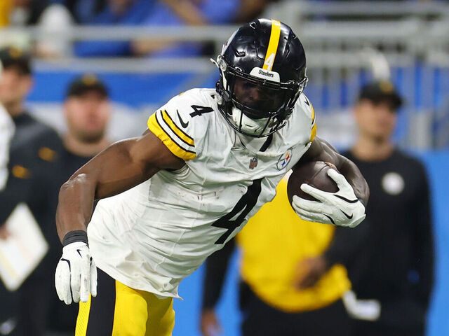 DETROIT, MICHIGAN - DECEMBER 21: DK Metcalf #4 of the Pittsburgh Steelers catches a pass in front of Avonte Maddox #29 of the Detroit Lions during the fourth quarter at Ford Field on December 21, 2025 in Detroit, Michigan.